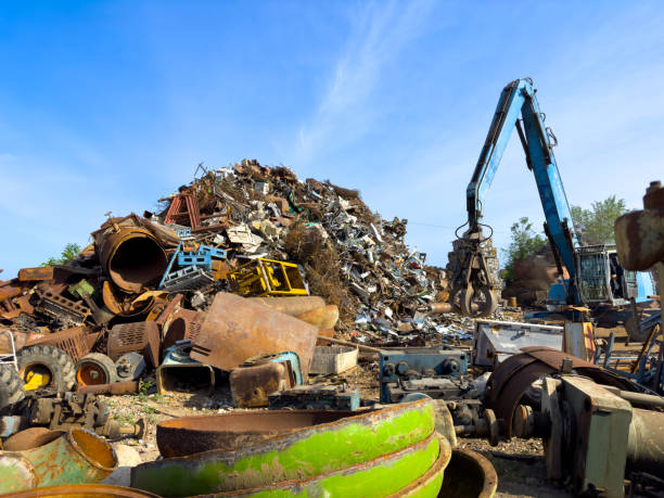 istock A crane is processing a mountain of scrap metal in the sky 2156668017