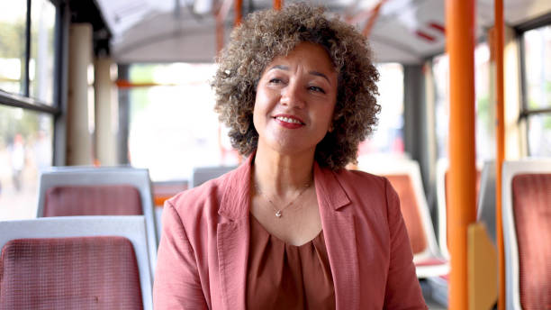 istock Businesswoman commuting by a bus 2156668829