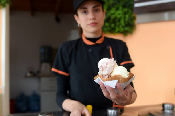 istock girl serving ice cream 2156671324