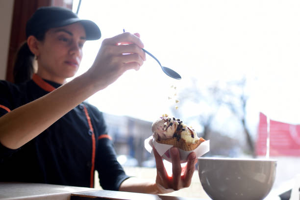 istock girl serving ice cream 2156671361