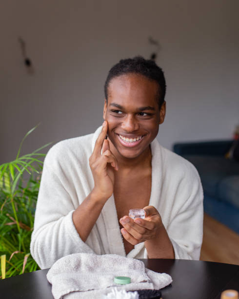 istock Young Black Man doing skincare routine in his home 2156675666
