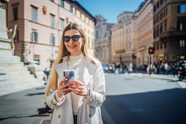istock Young woman using phone in the city 2156676629
