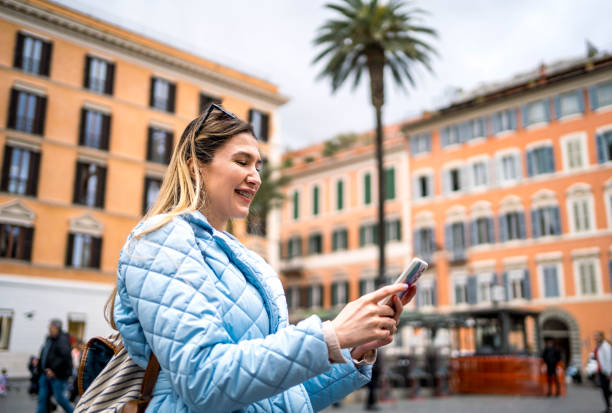 istock Woman using phone on Piazza de Spagna, Rome 2156676740