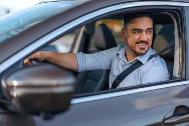 istock Smiling man driving and looking ahead 2156676936