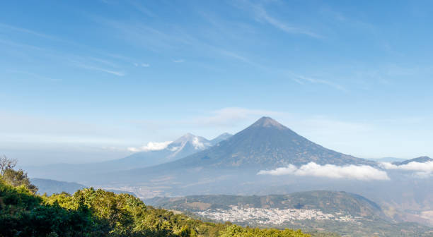 Volcanos agua acatenango and fuego in guatemala during a sunny day seen from pacaya Volcanos agua acatenango and fuego in guatemala during a sunny day seen from pacaya. guatemala landscape stock pictures, royalty-free photos & images