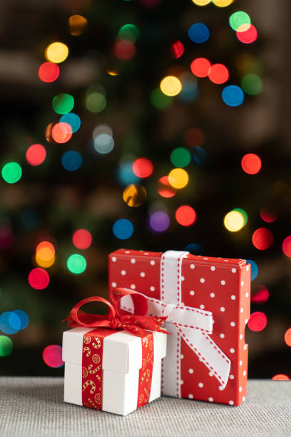 istock Two gifts in front of christmas tree 2156682270