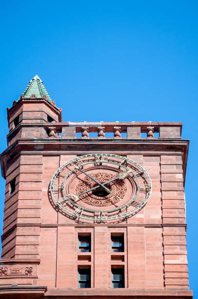 istock Red brick building exterior and clock 2156683491