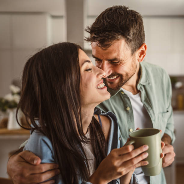 istock Boyfriend and girlfriend enjoy their first morning coffee at kitchen 2156685110