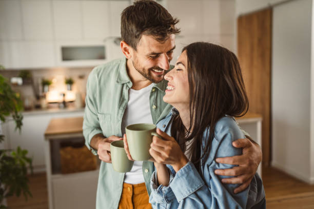istock Boyfriend and girlfriend enjoy their first morning coffee at kitchen 2156685147