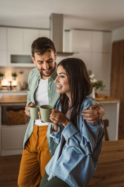 istock Boyfriend and girlfriend enjoy their first morning coffee at kitchen 2156685148