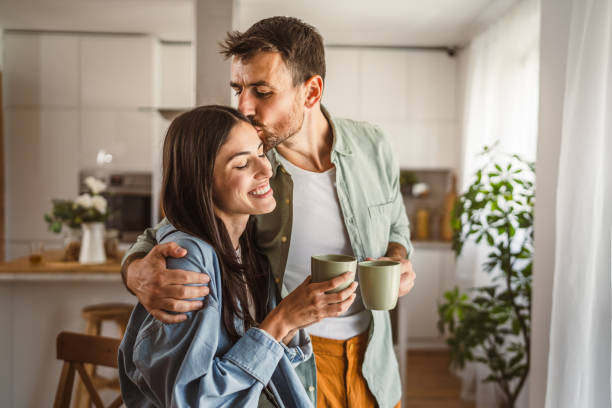 istock Boyfriend and girlfriend enjoy their first morning coffee at kitchen 2156685190