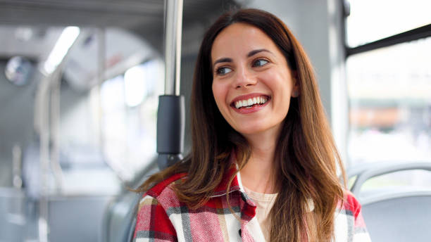 istock Smiling young woman enjoying a bus ride 2156687449