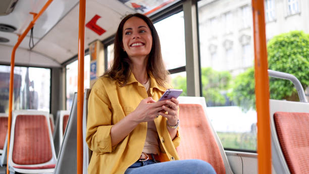 istock Girl having fun online during a bus ride 2156687558
