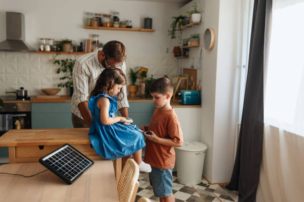 istock Father learning his children about sustainable energy 2156692738