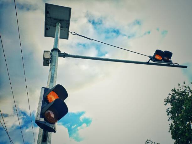 istock Traffic lights with black frames set against cloudy clouds are a sign for drivers to be careful 2156696771