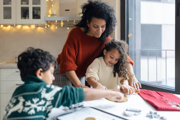 istock Family Baking Cookies Together 2156698034