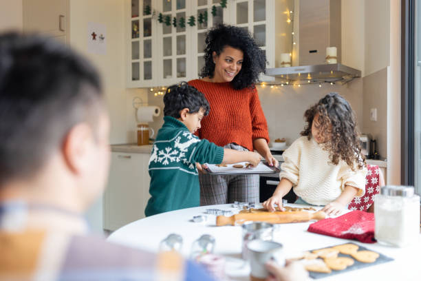 istock Family Baking Christmas Cookies in Cozy Kitchen 2156698037