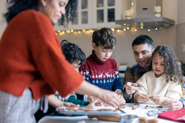 istock Family Making Holiday Cookies in Cozy Kitchen 2156698041
