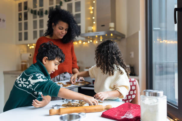 istock Family Baking Together in Cozy Kitchen During Holidays 2156698045