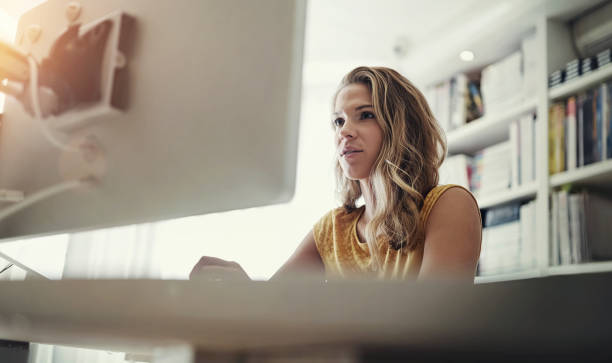 istock Computer, working and home office with woman and freelance writing in the study with tech. Entrepreneur, online and digital job with blog writer and internet search for article post for website below 2156698422