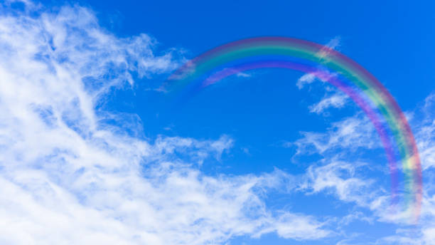 istock Bright blue sky with rainbow and sunshine 2156700933