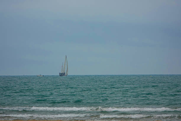 sailboat in blue sea. real video