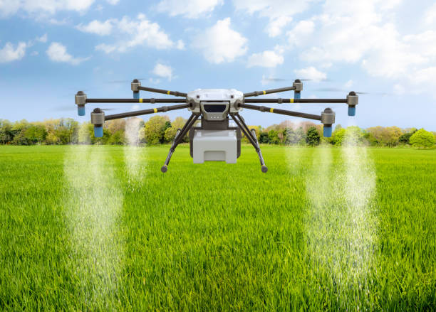 istock Agriculture technology with drone fly above and spray fertilizer 2156702073