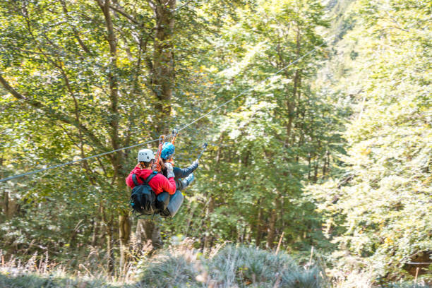 istock Energetic Duo Adventurers on Zip Line in Forest 2156703282