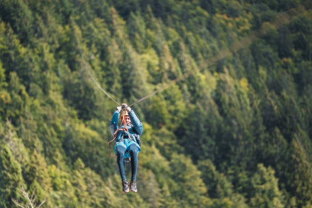 istock Energetic Male on Forest Zip Line Adventure 2156703289