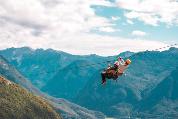 istock Realms Adventurers Zipline Above Mountain Embrace Mountain Peaks And Conquering Gravity 2156703313