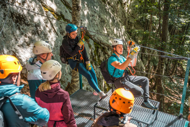 istock Experienced Zipline Instructor Demonstrating Finesse And Skill Ensuring Each Participant Feels Empowered And Ready For Exhilarating Flight 2156703316