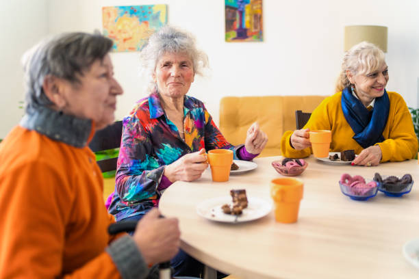 Three old friends catching up with each other over coffee