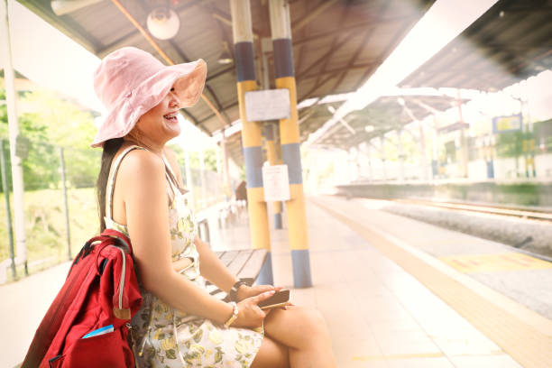 Asian woman at train station in Kuala Lumpur, Malaysia