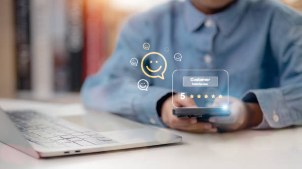 istock Customers press on the smartphone screen with a gold five-star rating feedback icon and press level excellent rank to give the best score point to review the service, business concept 2156705476