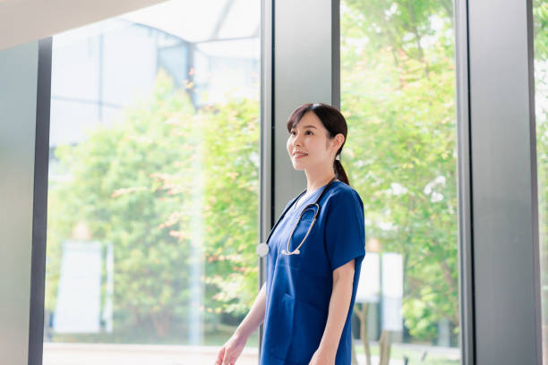 istock Doctor walking through a beautiful hospital. 2156707427