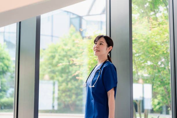 istock Doctor walking through a beautiful hospital. 2156707431