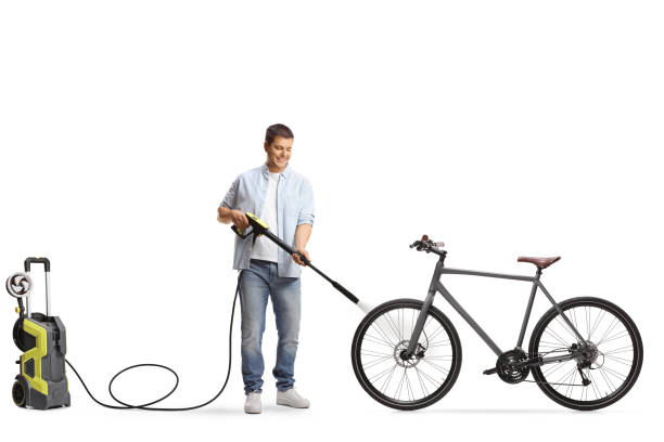 istock Man washing a bicycle with a high pressure washer machine 2156708497
