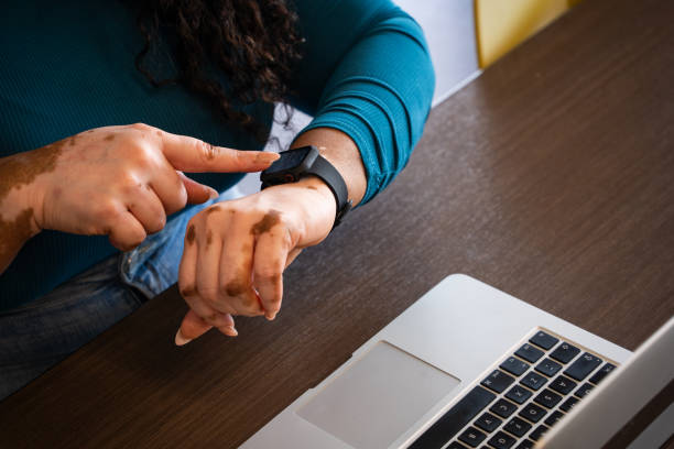 istock A woman interacting with her smart watch 2156709218