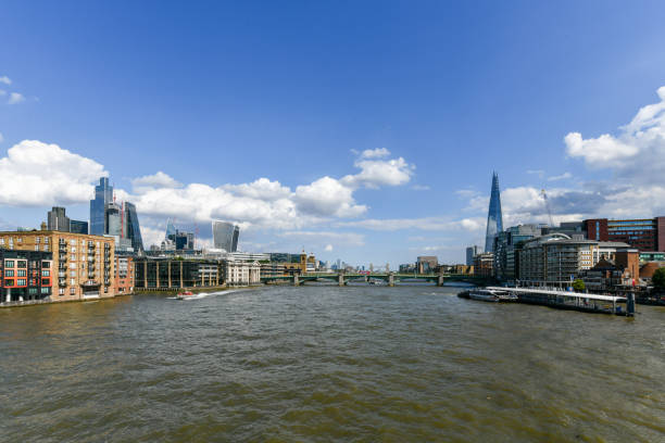 View from the Millennium Bridge along the Thames Bridge in London, UK.