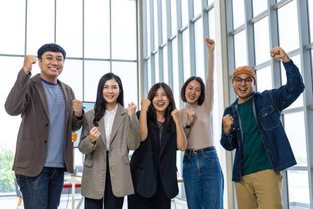 istock Happy diverse group Asian business start up freelance team analyzing statistics financial. Group Team of business people meeting conference discussion various topic corporate concept in office. 2156715274