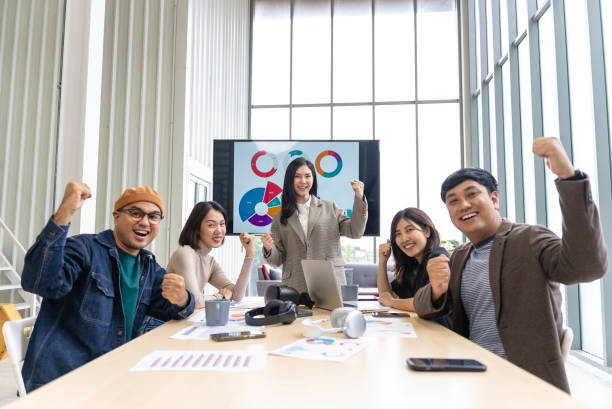 istock Happy diverse group Asian business start up freelance team analyzing statistics financial. Group Team of business people meeting conference discussion various topic corporate concept in office. 2156715297