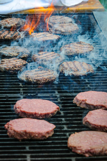 istock Smoking Burgers on the Grill 2156717304
