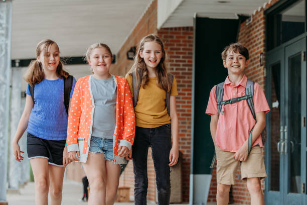 istock Elementary students walk to class together on first day of school 2156718604