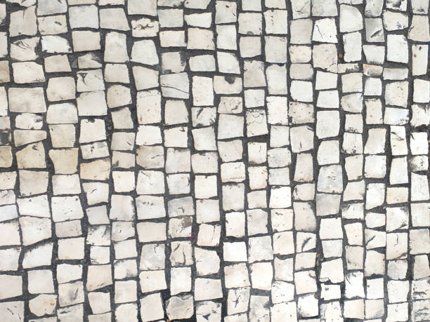 Close-up textured material shot of Old cobblestone city street flooring tile