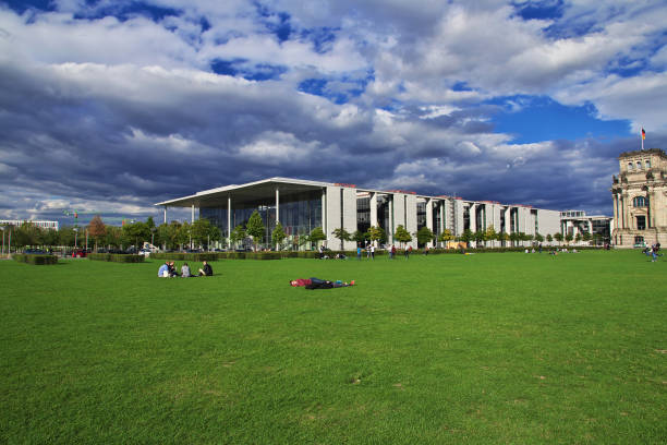 Contemporary building complex with geometric designs and a riverside location in Berlin, Germany.