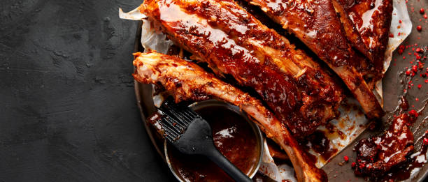 istock Grilled and smoked ribs with barbeque sauce. 2156723104