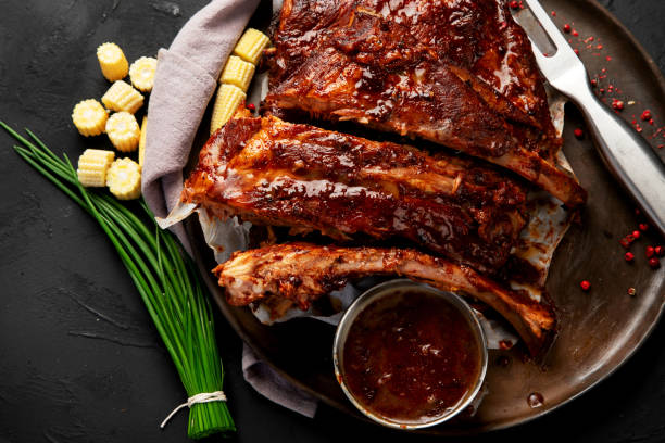 istock Grilled and smoked ribs with barbeque sauce. 2156723549