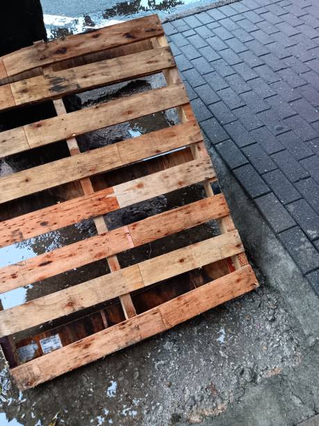 Germany, Berlin, Lichtenberg, August 24, 2025 - Stacked wooden transport pallets