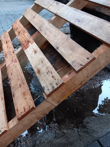 istock Wooden pallet getting wet on rainy day 2156723639
