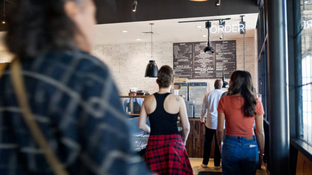 istock Customers Walking up to Order Kiosk at BBQ Restaurant in Houston 2156725523